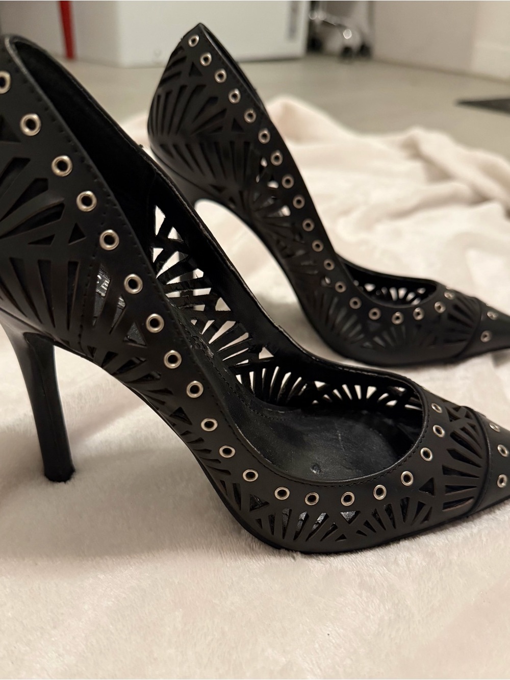 BCBGeneration Black Laser-Cut Grommet Pointed Toe Stiletto Heels